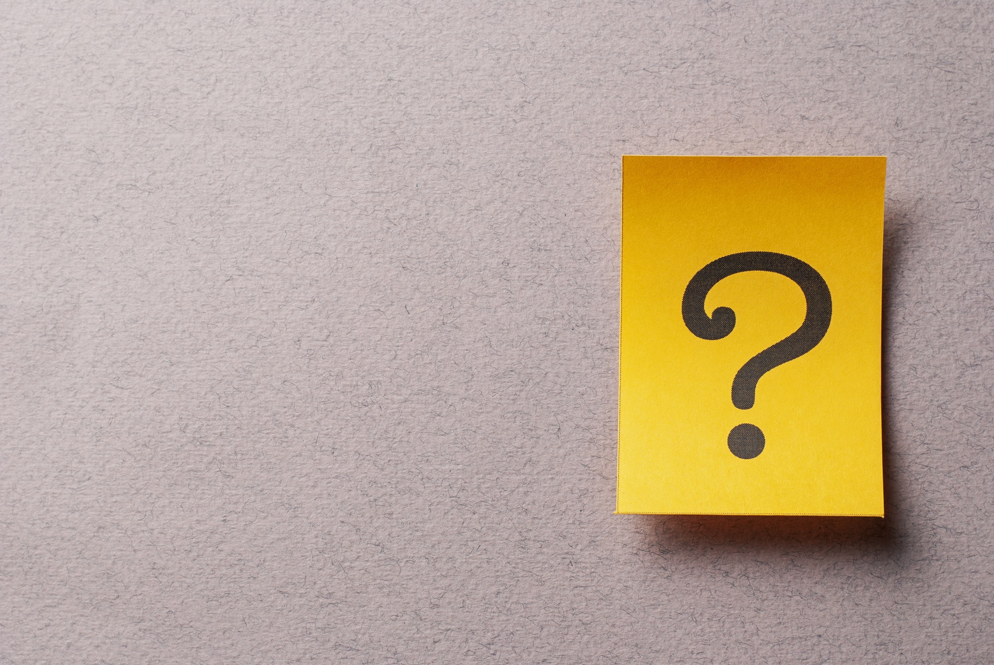 Colorful yellow card with printed question mark